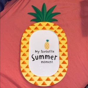 A Pineapple shaped photo frame (plastic)